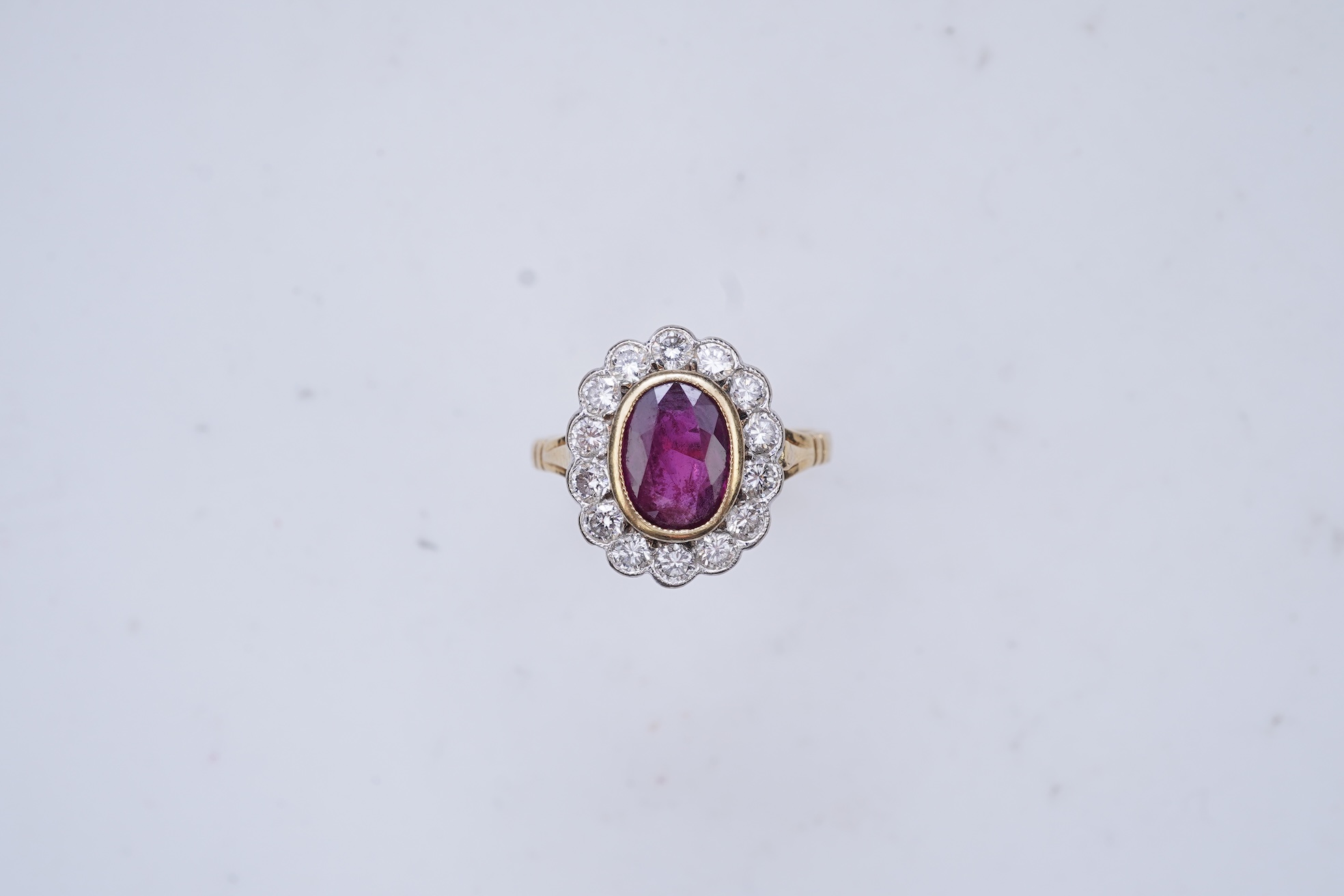 A ruby and diamond cluster ring